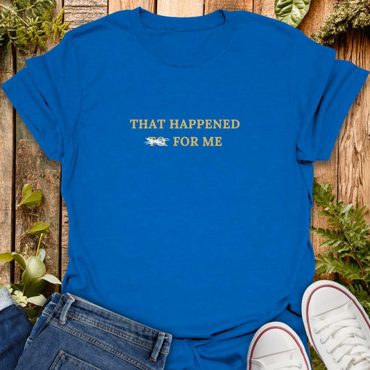 Blue t-shirt with 'That happened for me' text on a wooden background with plants, jeans and sneakers.
