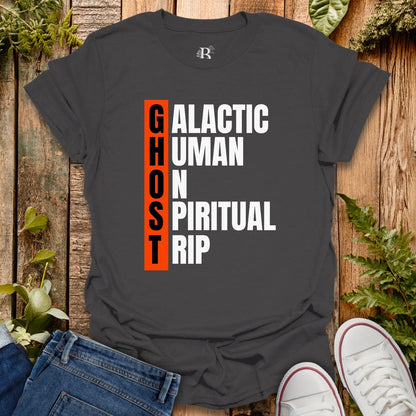Black t-shirt with text design on a wooden surface with jeans and sneakers.