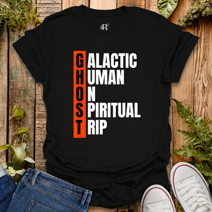 Black t-shirt with text design on a wooden surface with plants