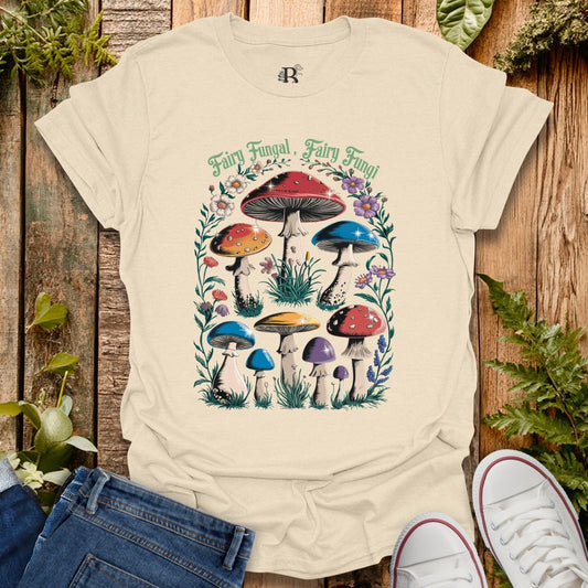 Beige t-shirt with colorful mushroom design on a wooden background