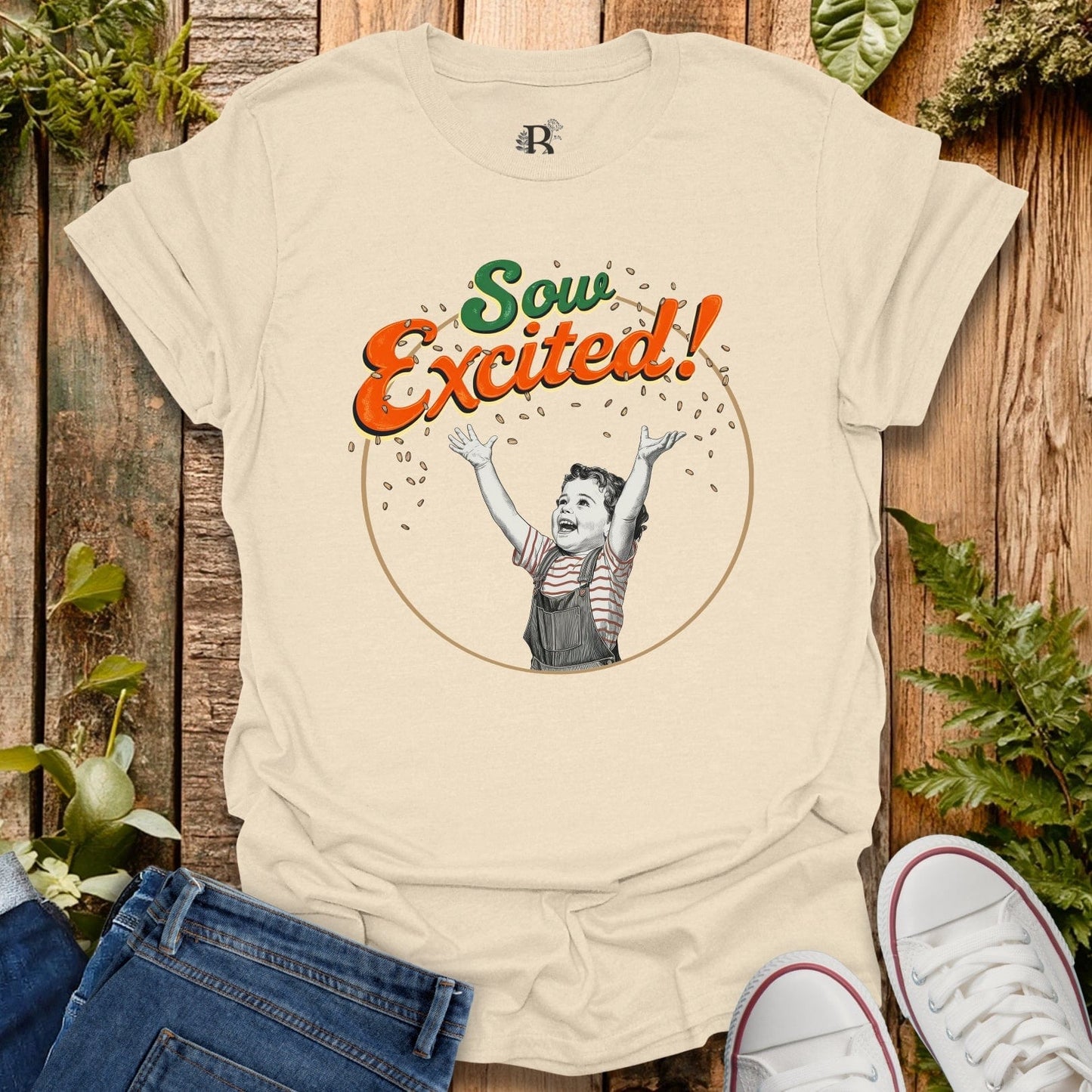 Beige t-shirt with 'Sow Excited!' graphic on a wooden background