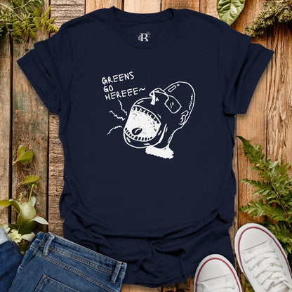 Navy blue t-shirt with white graphic design on a wooden surface with plants.