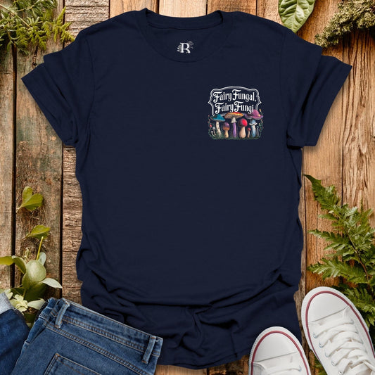 Navy blue t-shirt with mushroom graphic on a wooden surface with plants.