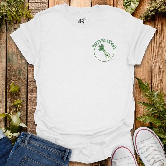 White t-shirt with a logo on a wooden surface with plants