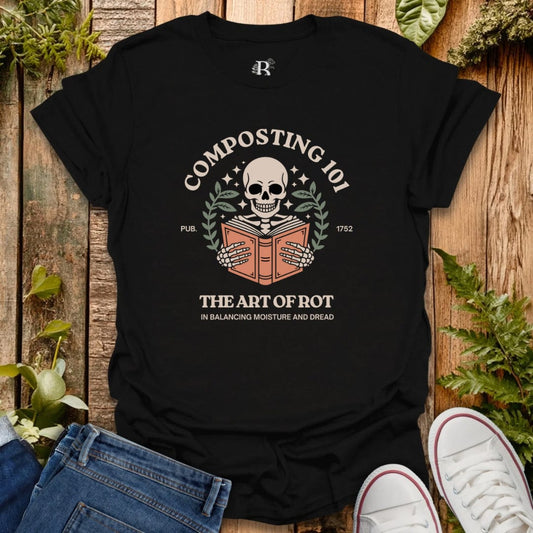 Black t-shirt with composting graphic on a wooden surface with plants