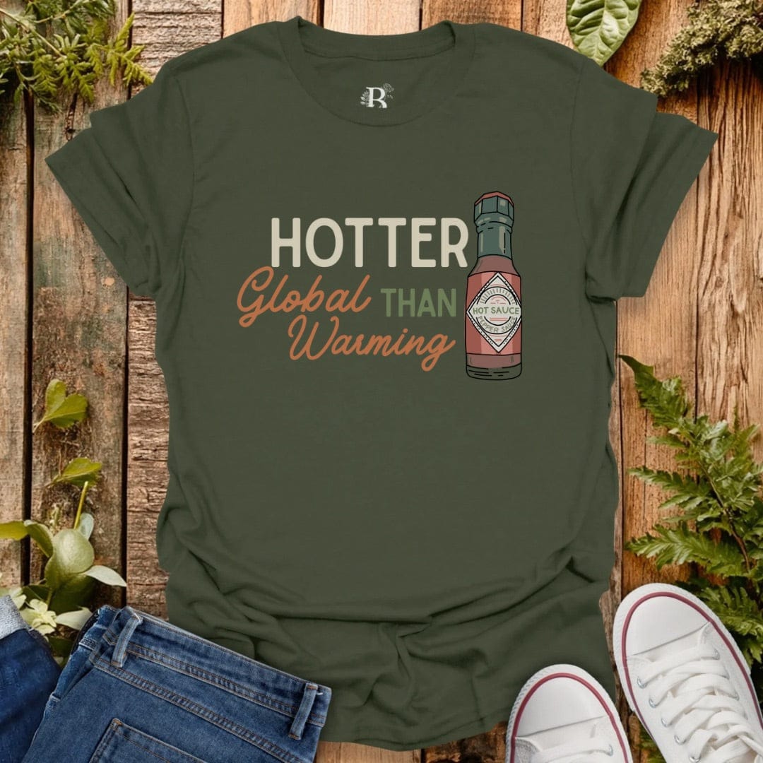 Green tee with text “hotter that  global warming” and bottle of hot sauce graphic.
