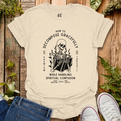 Beige t-shirt with a graphic design on a wooden background