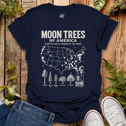 Navy t-shirt with ‘Moon Trees of America’ text, and a map of the locations of moon trees, and a comic style photo of astronaut  Stuart Roosa. 
