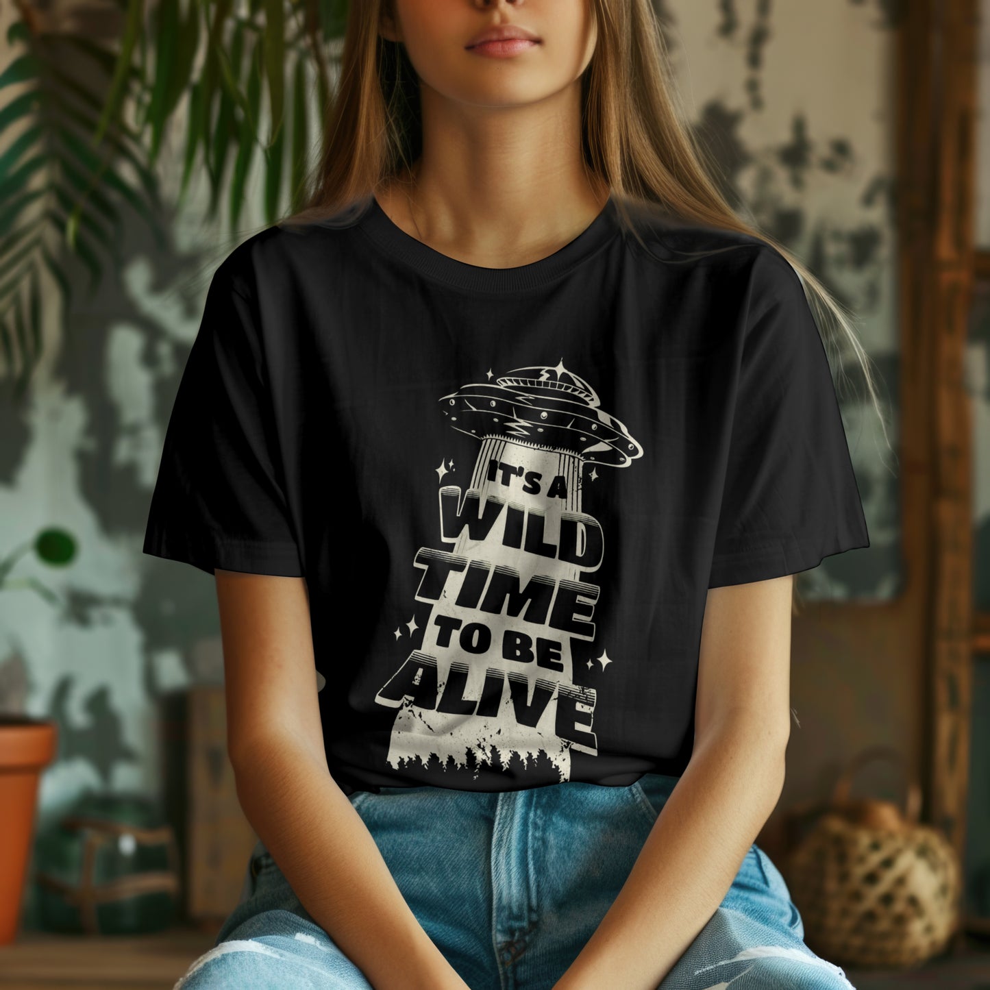 Girls wearing black T-shirt with UFO graphic design.